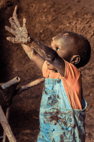 Uganda Child playing in mud